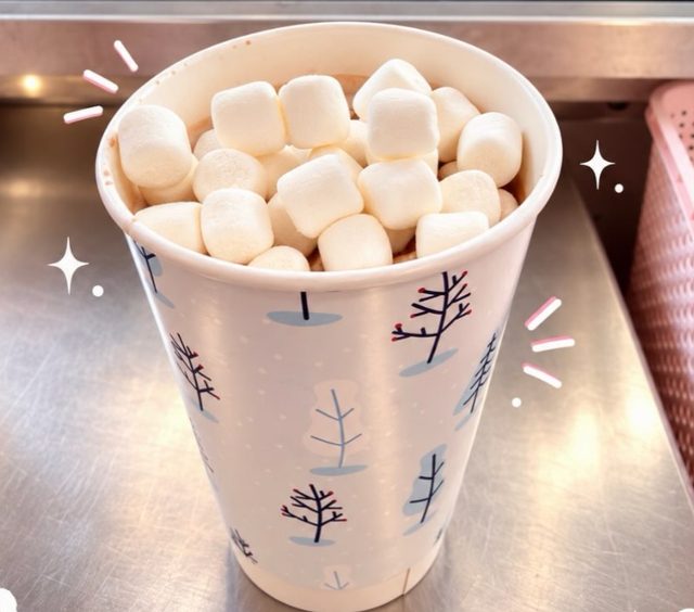 A cup of BooGi Bliss Crockpot Hot Chocolate piled high with marshmallows