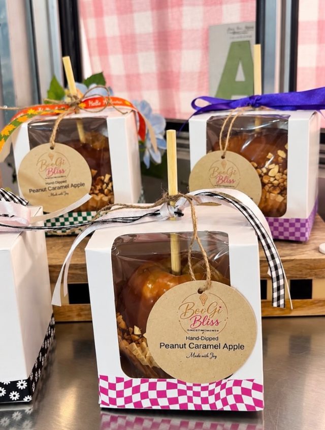 Hand-dipped peanut caramel apples in clear gift boxes tied with ribbon and BooGi Bliss tags